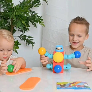 Children playing with ClickBlox soft magnetic STEM building blocks, colorful oversized pieces for safe creative play