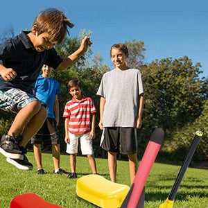 Kids playing outdoors with dual toy rocket launcher in a grassy park with trees