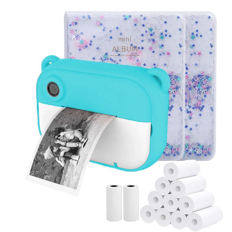 Blue kids instant print camera printing black and white photo with thermal paper rolls and mini star-patterned albums.