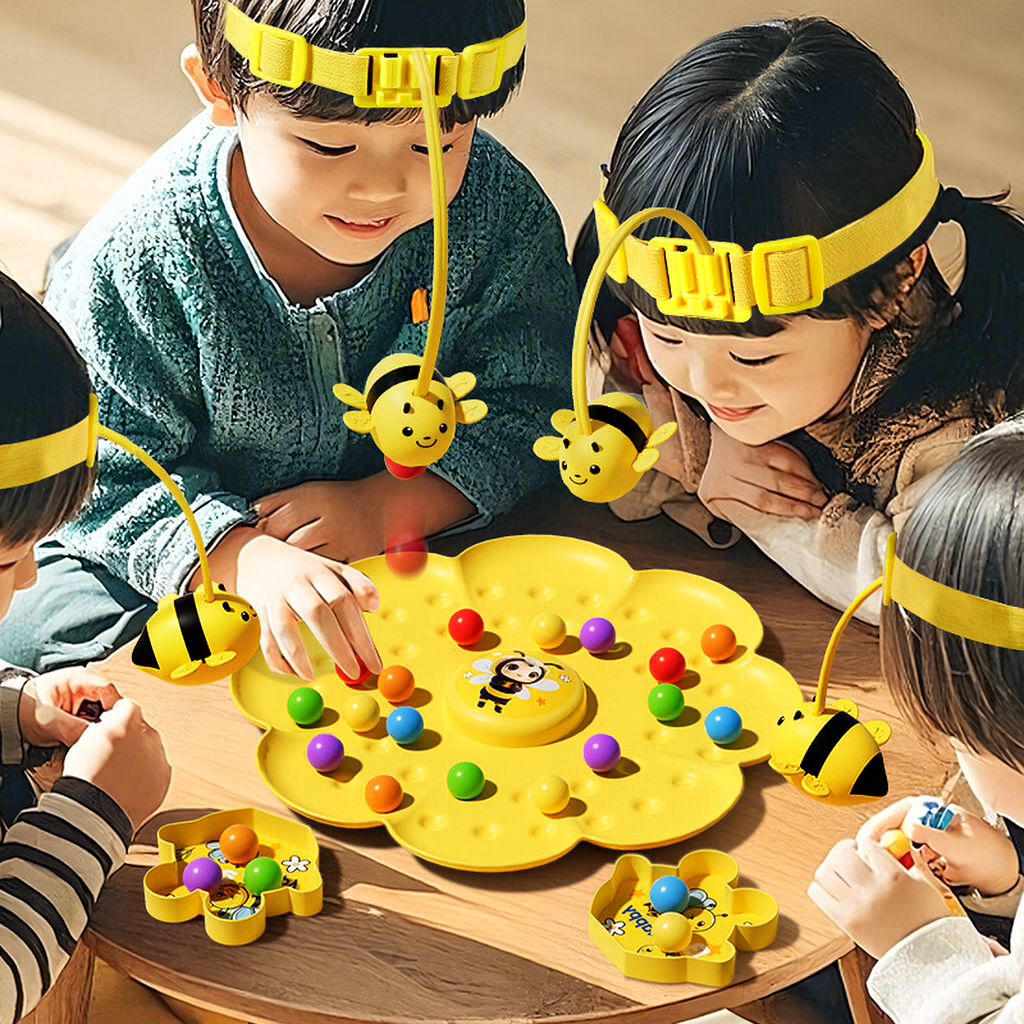 Children playing with a yellow magnetic bee honey collecting toy promoting interactive multiplayer fun and skill development