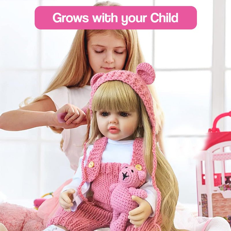 child playing with lifelike real-feel baby doll wearing pink knitted outfit and holding teddy bear
