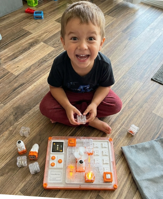Boy solving the STEM Circuit Puzzle Board