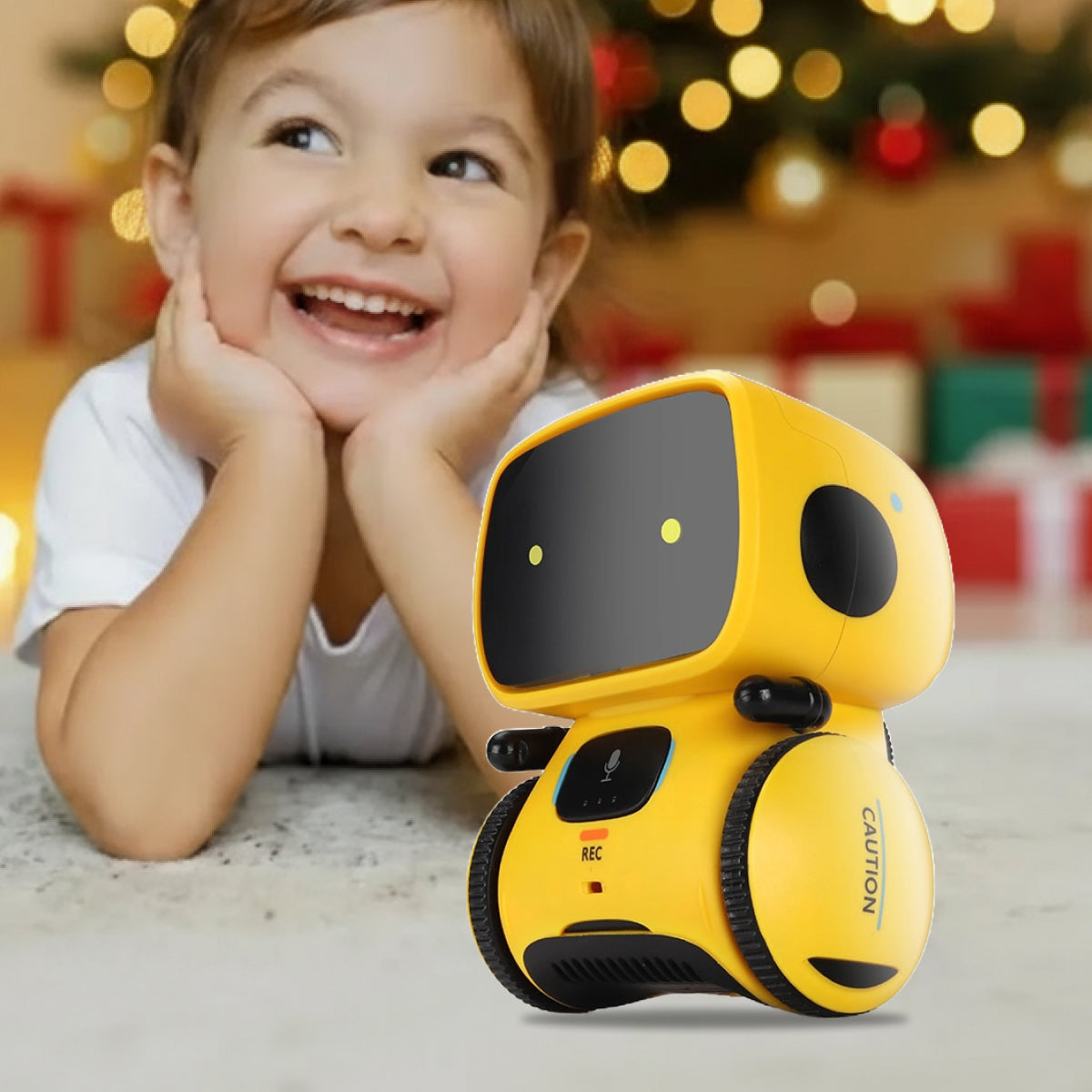 Child smiling next to yellow Robby the Robot interactive toy on Christmas background
